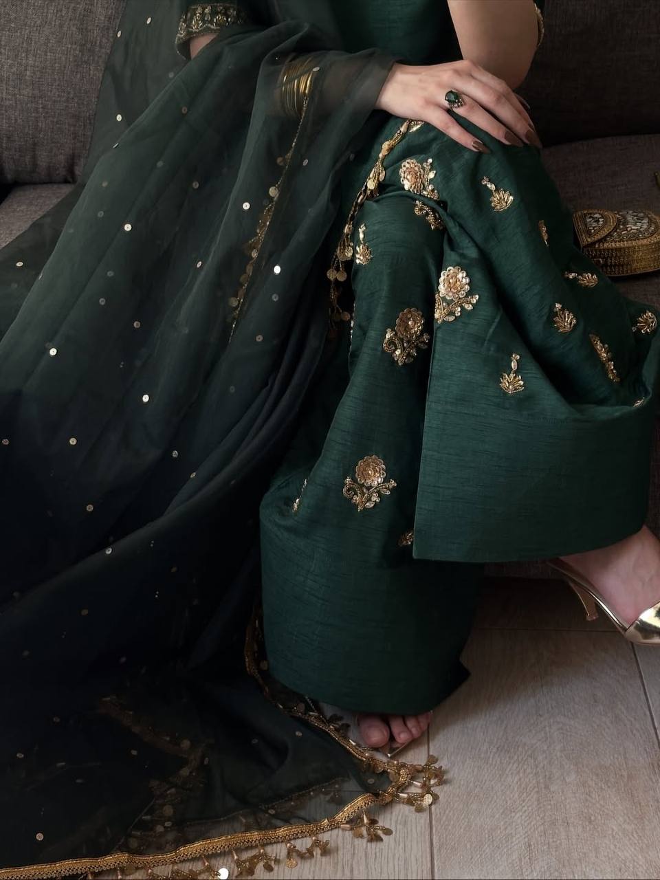 Majestic Emerald Green Kurta and Salwar Suit Set Featuring Intricate Gold Embroidery, Floral Motifs, and Ornate Coin Tassel Embellishments